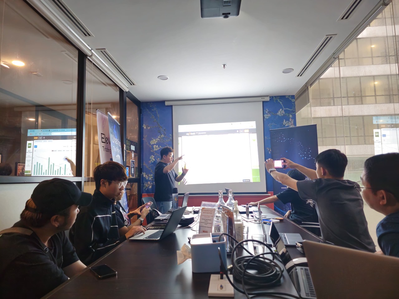Boardroom briefing with attendees and screen presentation